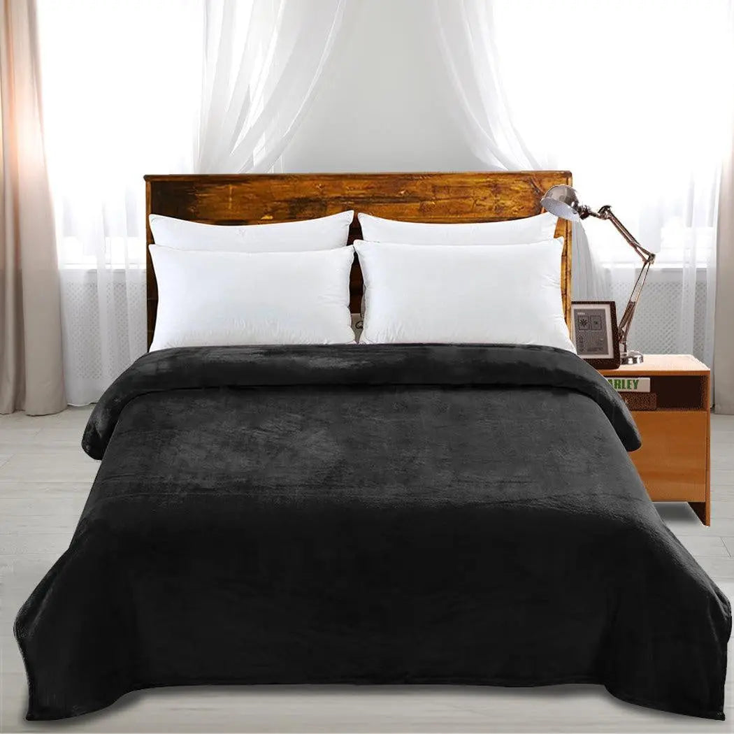 DreamZ 320GSM Ultra Soft Mink Blanket in Black, showcasing its plush texture and generous size, perfect for cozying up.